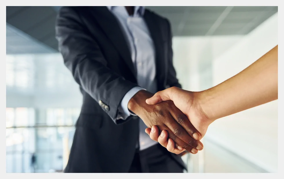 Handshake in suits